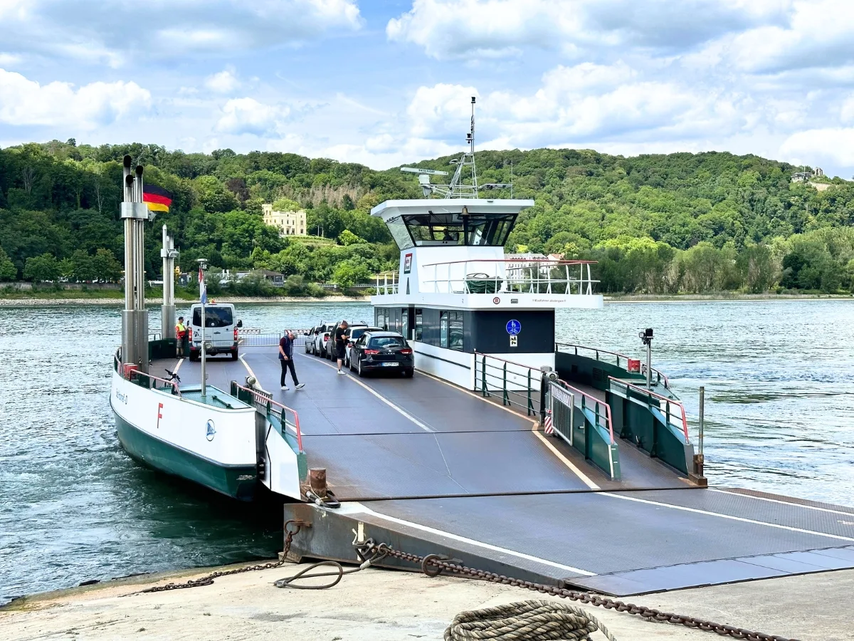 Vehicle ferry with an open ramp at a landing.